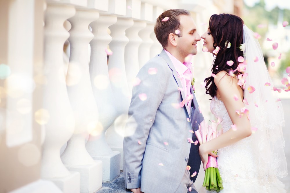 Bride and groom with floating petals