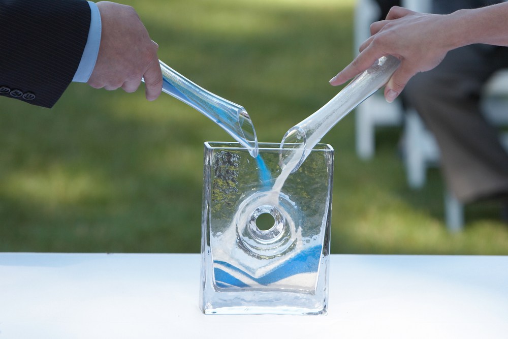 Bride and groom pouring sand together