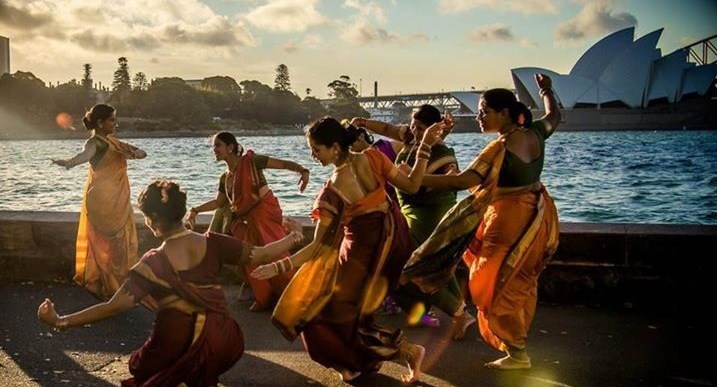 Women dancing at cultural festival on sydney harbour