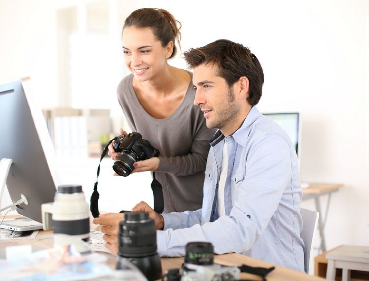 Photographers editing photos