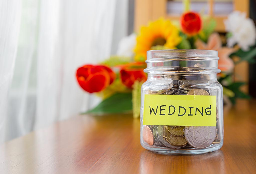 Coin jar with wedding written on