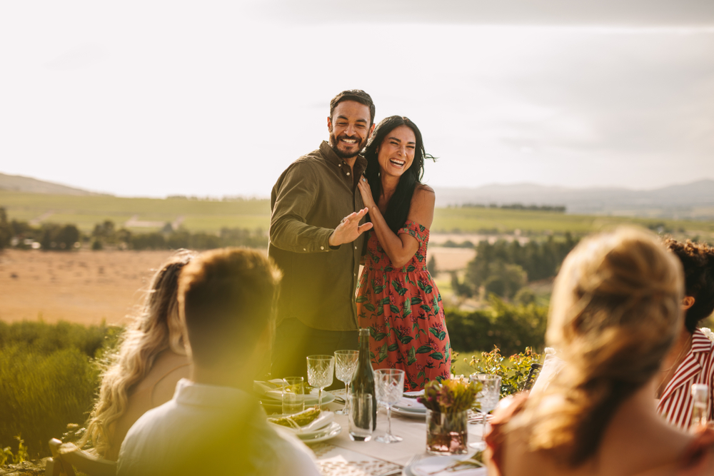 Couple Announcing Engagement at party