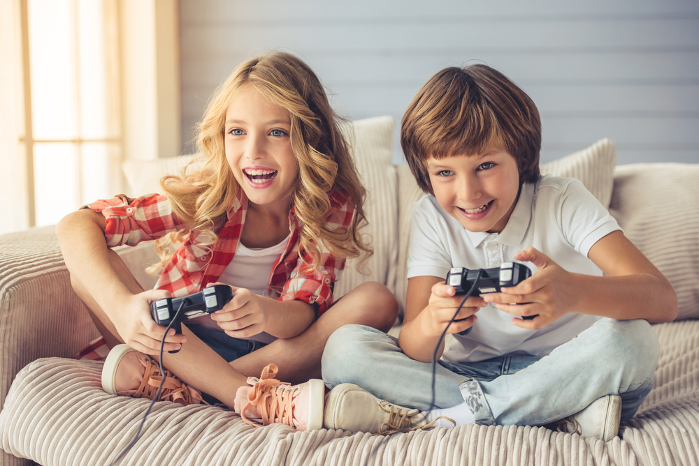 Children playing video games at a kids party