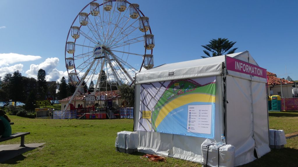 Festival marquees for hire and a ferris wheel in the background